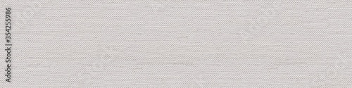 Linen canvas background in superlative white color as part of your design project. Seamless panoramic texture.