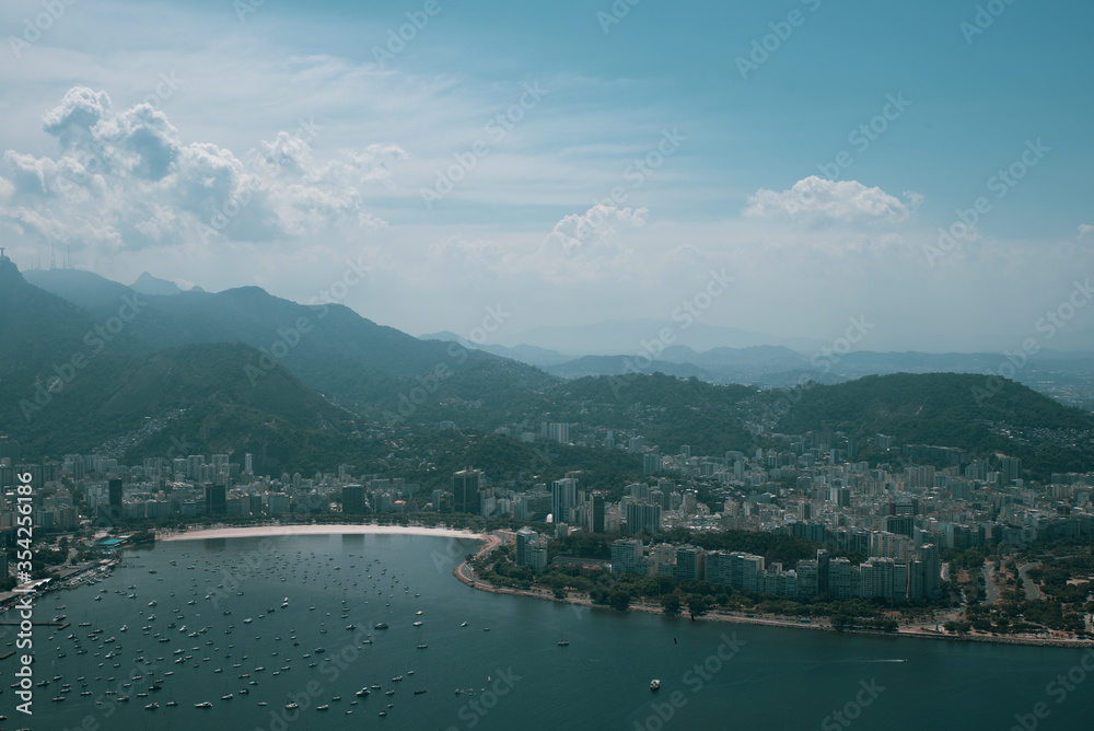 View of the Sugar Loaf in Botafogo, a mountain, and a landscape of Rio de Janeiro from a cable car, Brazil. 