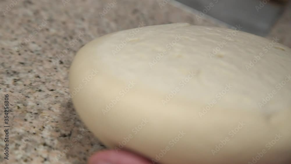Chef is making pizza dough. Hands and dough. Cooking pizza dough. Chef preparing the dough for the pizza.
