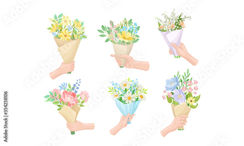 Hands Holding Flower Bouquets Wrapped in Craft Paper Vector Set