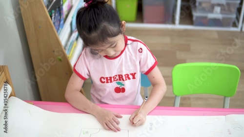 4K : Happy Asian girl draw picture on paper, Happiness moment at home