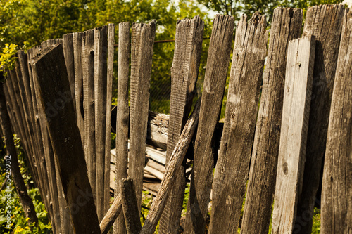 an old fence collapsed in a Russian village