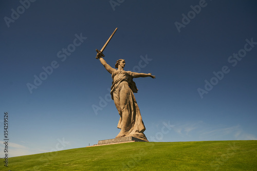 A person flying through the air on top of a grass covered field