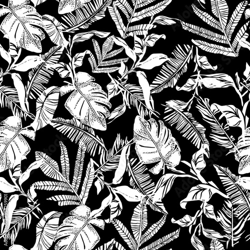 Vector seamless pattern with compositions of graphical tropical leaves, palm leaves,banana leavesand jungle plants.