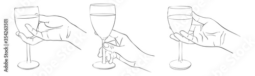 hands with glasses of wine
