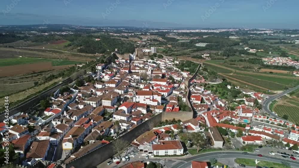 Aerial around view of medieval town Obidos with wall and fortress, Portugal, 4k Aerial around view of medieval town Obidos with wall and fortress, Portugal, 4k