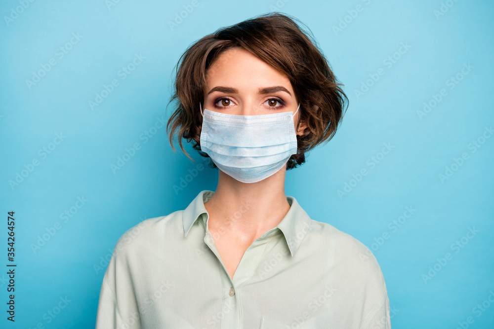 Close-up portrait of nice pretty charming sick ill lady short bob hairstyle wearing gauze mask chronic disease therapy decontamination concept isolated bright vivid shine vibrant blue color background