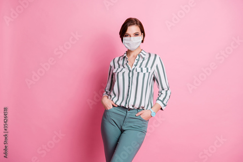 Portrait of her she attractive pretty lovely girl wear stylish millennial clothing gauze mask anti stop sars cov disease illness sickness isolated over pink pastel color background