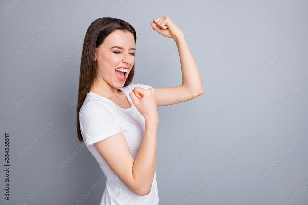 Profile photo of attractive crazy lady arms fists raised yelling loudly support football sports team excited fan wear casual white t-shirt isolated grey color background Profile photo of attractive crazy lady arms fists raised yelling loudly support football sports team excited fan wear casual white t-shirt isolated grey color background