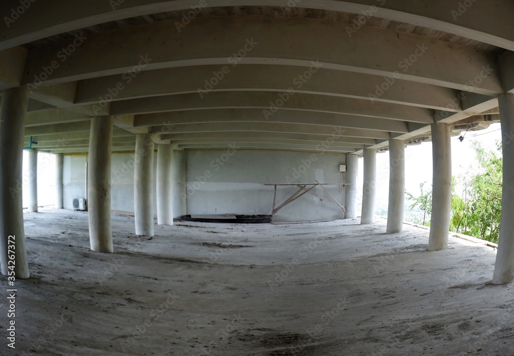 Concrete construction, unfinished abandoned building wide angle picture