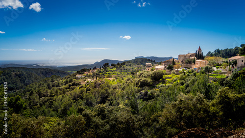 peaceful mountain village galilea towers over large olive groves with fantastic view to the mediterranean sea photo