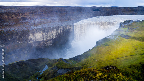 spectacular wide angle panorama of the gigantic dettifoss in iceland, the most powerful waterfall in europe