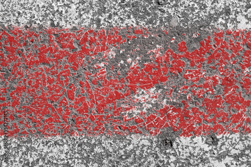 Old red and white painted asphalt texture