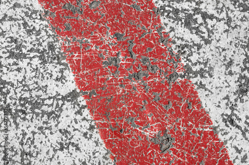 Old red and white painted asphalt texture