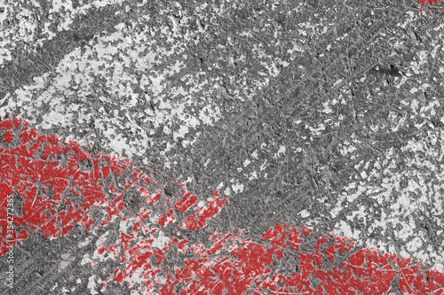 Old red and white painted asphalt texture