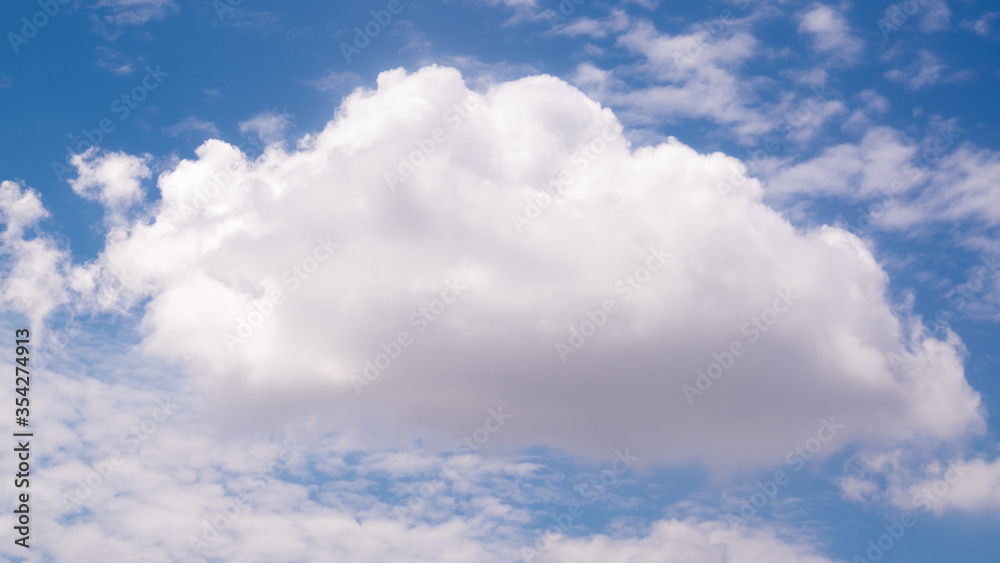 Big single nature white cumulus cloud on clear blue sky background Big single nature white cumulus cloud on clear blue sky background