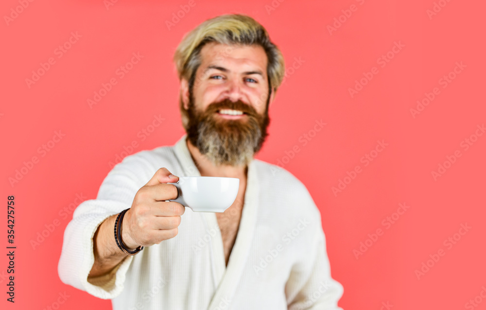 Morning begins with coffee. Understanding Your Daily Rhythms. Man with beard in bathrobe enjoy morning coffee. Guy in domestic clothes hold coffee cup. Bearded man with mug. Breakfast concept Morning begins with coffee. Understanding Your Daily Rhythms. Man with beard in bathrobe enjoy morning coffee. Guy in domestic clothes hold coffee cup. Bearded man with mug. Breakfast concept