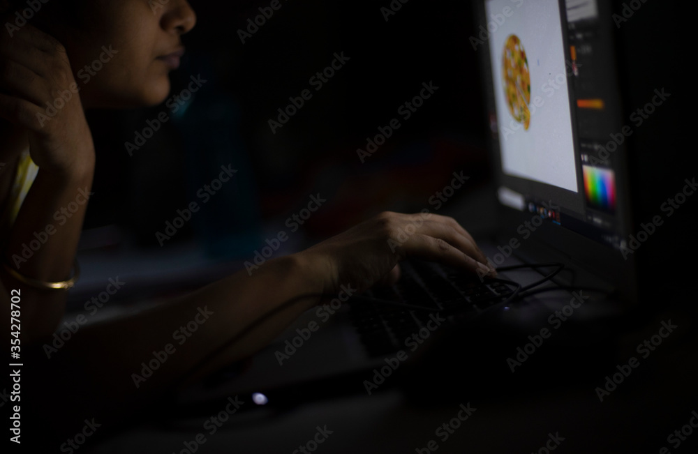 Indian young woman doing work with a computer in home isolation due to covid - 19. Indian lifestyle Indian young woman doing work with a computer in home isolation due to covid - 19. Indian lifestyle