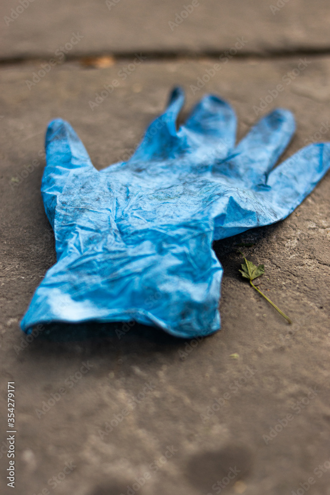 Photo of a close up plastic glove thrown away in the streets of London Photo of a close up plastic glove thrown away in the streets of London