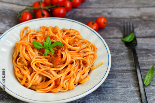  Close up of home made spaghetti bolognese with tomato sauce from cherry tomatoes and basil