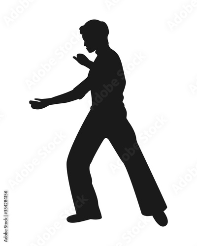 Silhouette of a man in a dance or sports pose isolated on white background