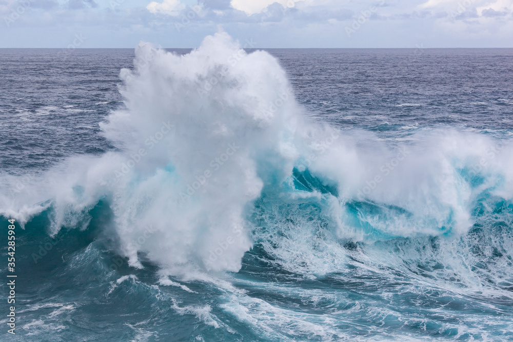 A big beautiful breaking Ocean wave near the shore of the Tenerife island, Canary Islands, Spain