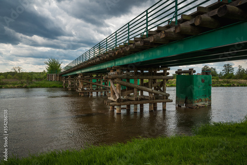 Obraz na płótnie Longest wooden bridge over the Pilica river in Gostomia, Poland w salonie