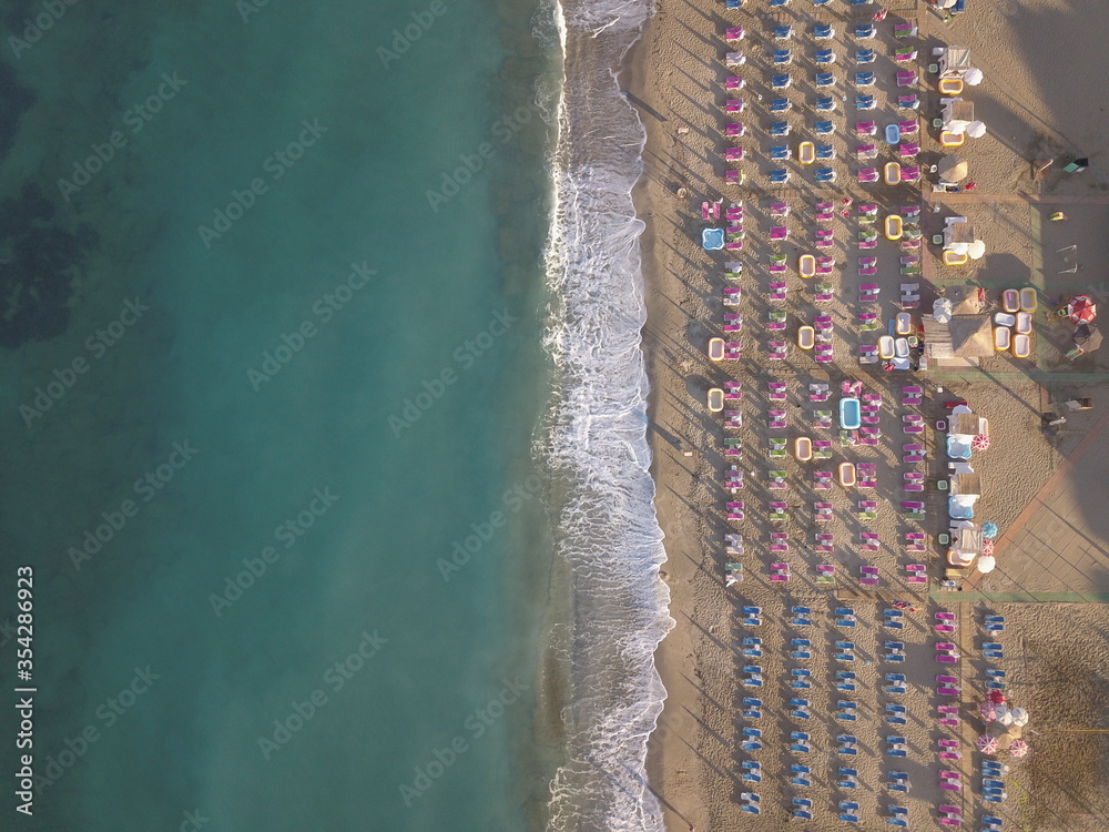 View of the beach, waves on the beach, turkey, alanya, Mediterranean sea, travel around turkey, sun loungers and parasols