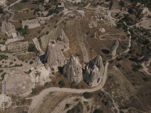 Cappadocia, view from the top of the mountain, Kapadokya, Turkey, Uchisar Castle in Cappadocia Region of Turkey, Aerial view of the balloons flying over Cappadocia