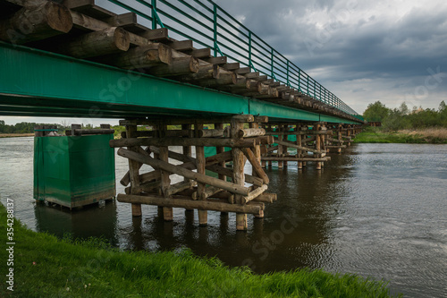 Longest wooden bridge over the Pilica river in Gostomia, Poland © Artur Bociarski