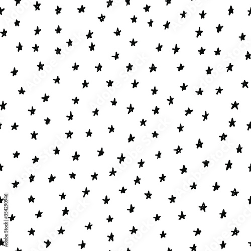 Hand drawn star seamless pattern. Cute childish stellar texture about magic, christmas, party. Black and white geometric background. Sketch stylized abstract shapes backdrop.