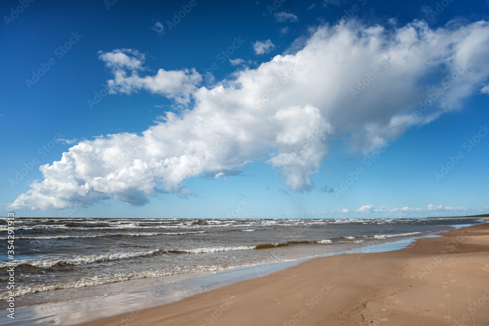 Beautiful seascape, sandy beach sky with clouds and cold sea, Baltic Sea. Beautiful seascape, sandy beach sky with clouds and cold sea, Baltic Sea.