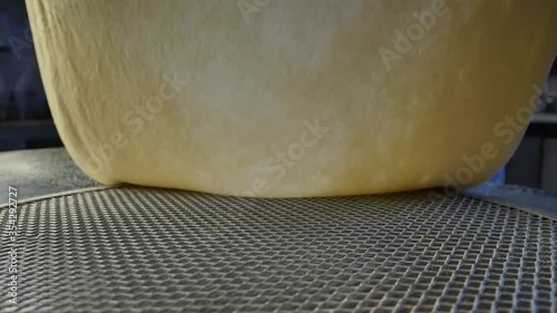 dynamic closeup of making pizza dough at italian restaurant
