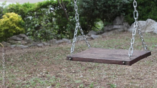 Empty swing at the children's playground

