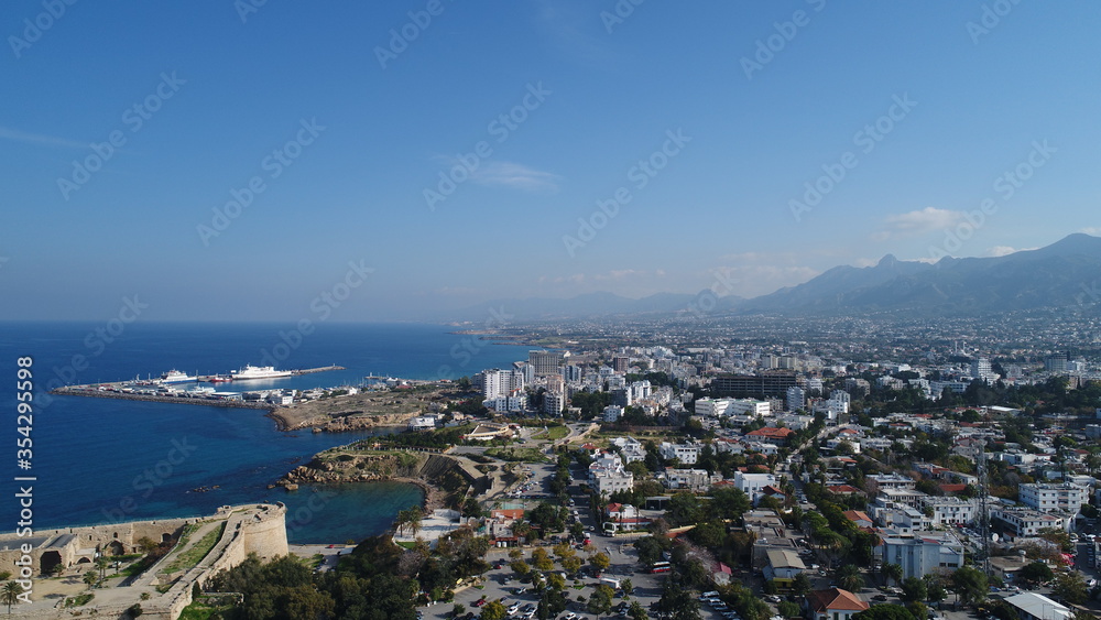 Cyprus Kyrenia Drone Footage from sky mountains city view Mediterranean sea Girne North Cyprus KKTC blue color best holiday summer sunny