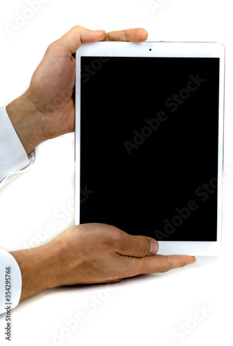 Tablet held by hands bussiness message black screen