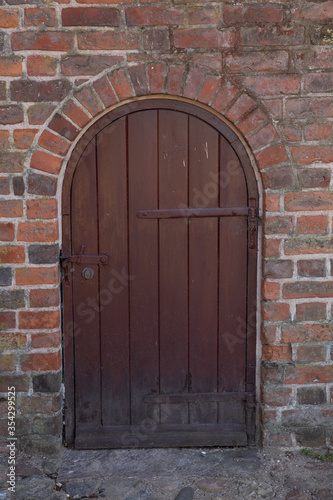 old church door with bricks 