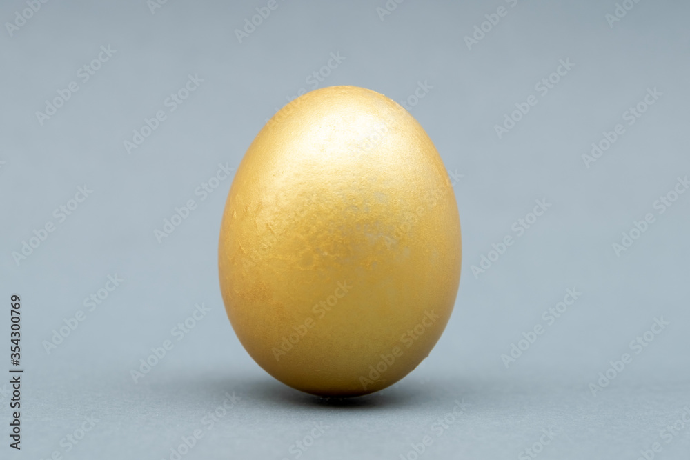 Golden egg isolated on gray background Golden egg isolated on gray background