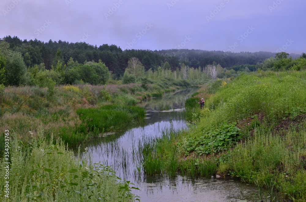 fishing by the stream, evening sunset. men's company, evening calm.