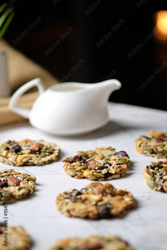 Mixed Nut and Dried fruits and Seeds Florentine, Gluten free whole foods Healthy biscuit cookies. set on cafe table.