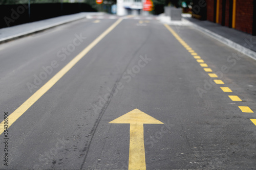 yellow arrow on the asphalt