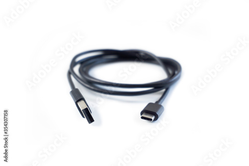 Black USB type c cable on white background
