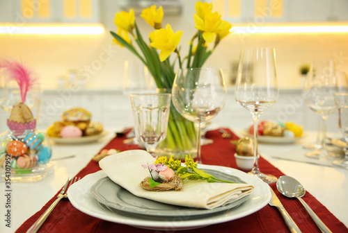 Festive Easter table setting with decorated eggs