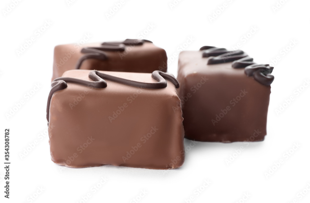 Delicious milk chocolate candies isolated on white Delicious milk chocolate candies isolated on white