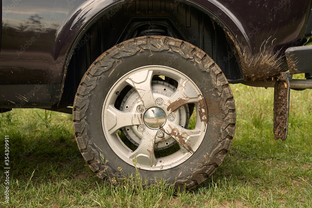 Wheel of a 4x4 vehicle with mud