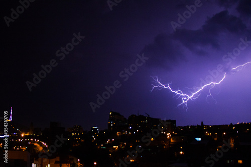 Thunderstorm and city view of Building roofs, architecture and history landmarks, must visit place.