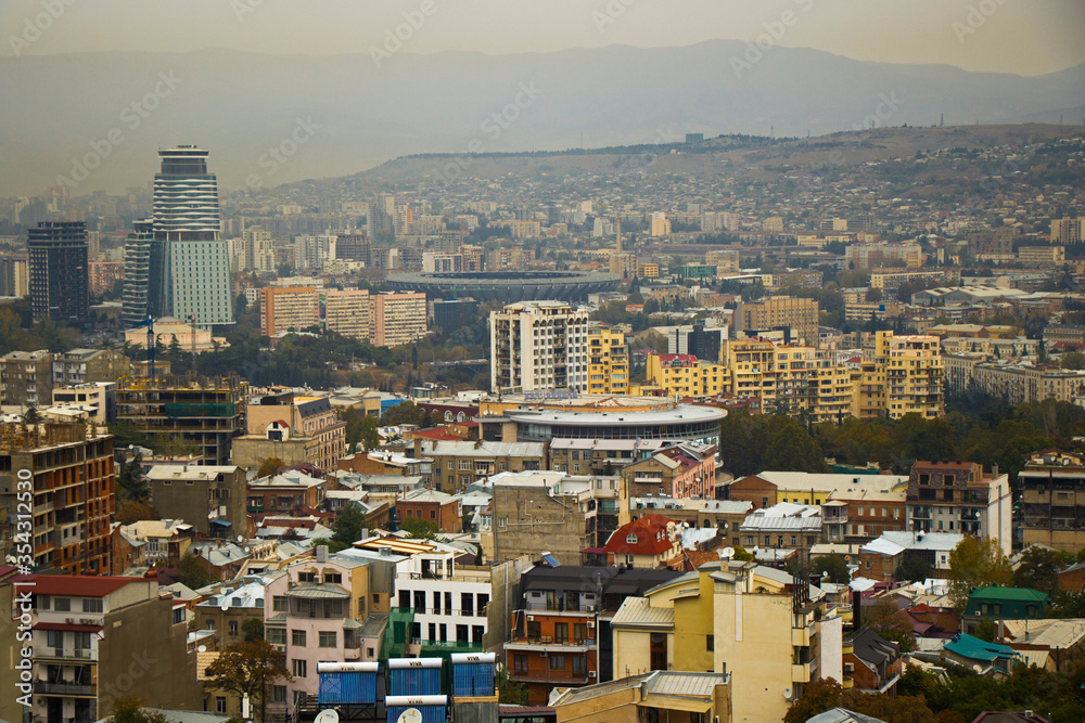Naklejka premium City view and city scape of Tbilisi. Building roofs, architecture and history landmarks, must visit place.