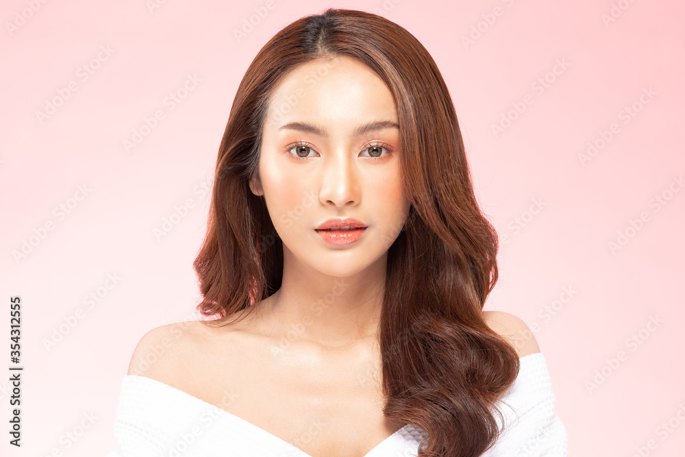 Fototapeta premium Beautiful Asian woman wearing bathrobe smile with clean and fresh skin Happiness and cheerful with positive emotional,isolated on white background,Beauty Cosmetics and spa Treatment Concept