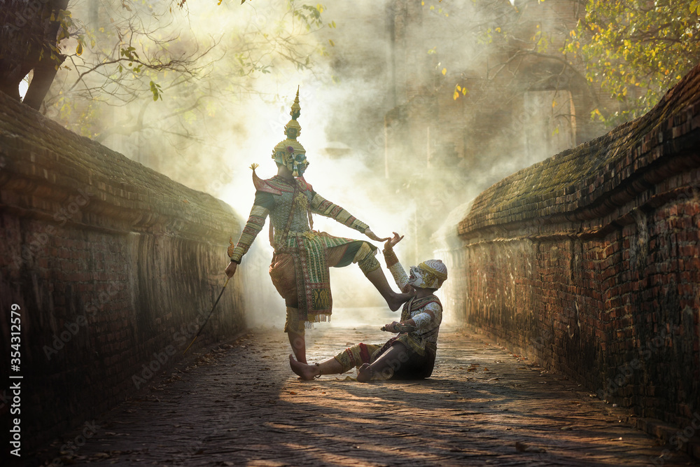 Fototapeta premium KHON THAI, the giant fighting with Hanuman or the white monkey, the character of Ramayana in Thai literature.Smoke background blur.