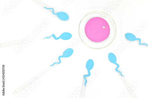 In vitro fertilization concept. Sperm and egg cell on test tube and petri dish in laboratory.